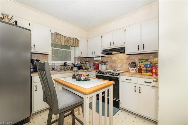 kitchen with crown molding, stainless steel refrigerator, white cabinetry, sink, and black electric range oven