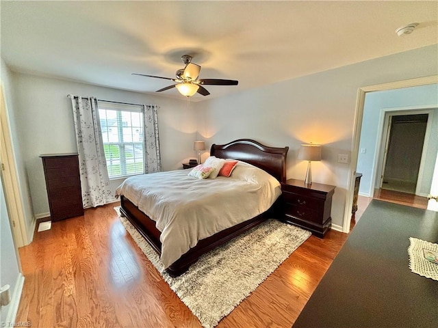 266 Sailway Rd, Winston-Salem, NC 27127 - bedroom featuring wood finished floors, a ceiling fan, and baseboards