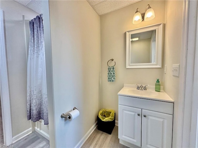 266 Sailway Rd, Winston-Salem, NC 27127 - bathroom featuring vanity, wood finished floors, and baseboards