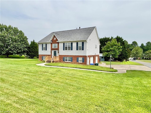 266 Sailway Rd, Winston-Salem, NC 27127 - bi-level home with an attached garage, a front lawn, driveway, and brick siding