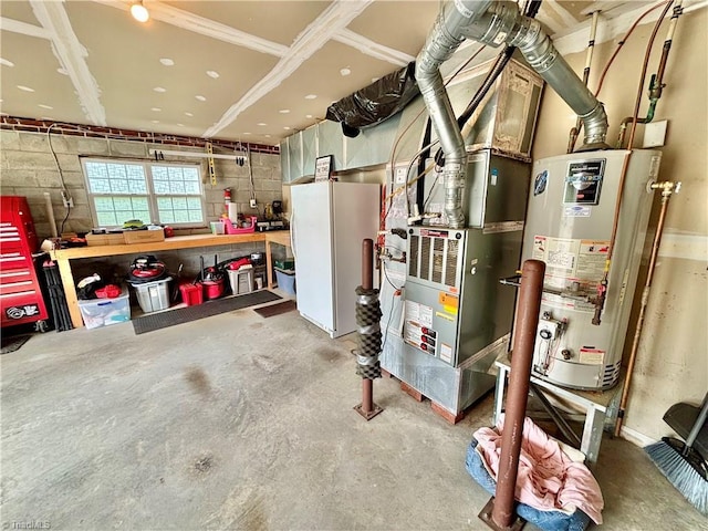 266 Sailway Rd, Winston-Salem, NC 27127 - garage featuring a workshop area, gas water heater, and freestanding refrigerator