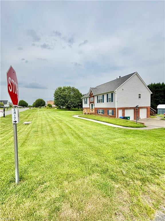 266 Sailway Rd, Winston-Salem, NC 27127 - view of grassy yard featuring a garage