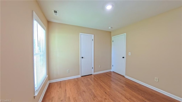 2209 Bracyridge Rd, Greensboro, NC 27407 - unfurnished bedroom with baseboards and light wood-style flooring