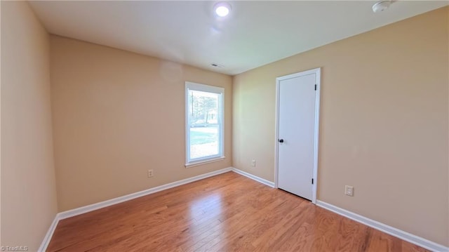 2209 Bracyridge Rd, Greensboro, NC 27407 - unfurnished room with light wood-type flooring, baseboards, and a smoke detector