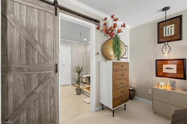 interior space with crown molding and a barn door