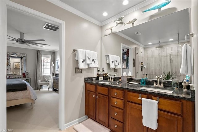 bathroom featuring crown molding, an enclosed shower, ceiling fan, and dual bowl vanity