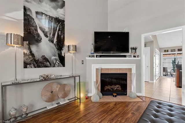 tiled living room featuring a tile fireplace