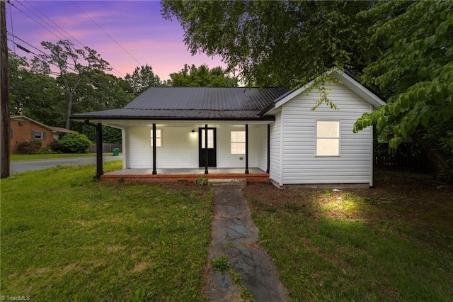 301 Rockspring Rd, High Point, NC 27262 - view of front of house with a porch, a lawn, and a metal roof