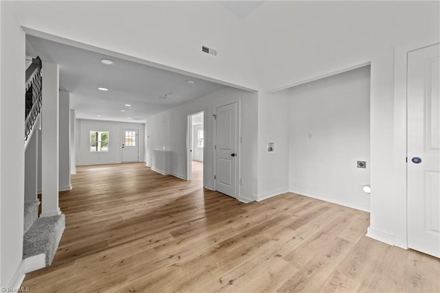 301 Rockspring Rd, High Point, NC 27262 - unfurnished living room with light wood-style flooring and recessed lighting