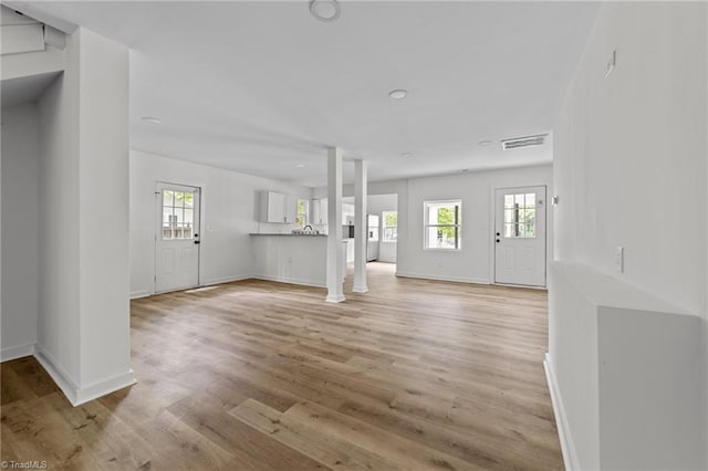 301 Rockspring Rd, High Point, NC 27262 - foyer with healthy amount of natural light, light wood-style floors, and ornate columns
