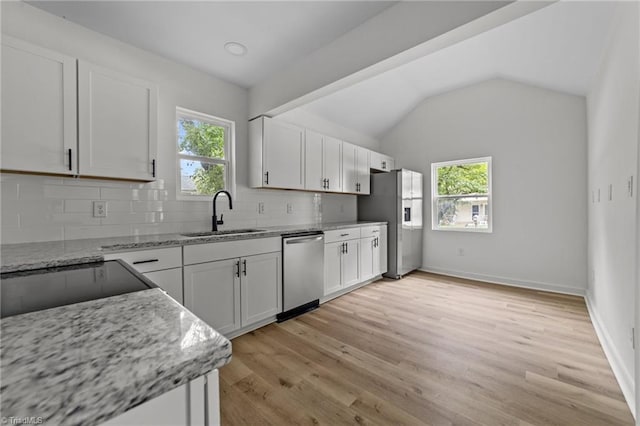 301 Rockspring Rd, High Point, NC 27262 - kitchen with stainless steel appliances, backsplash, light stone counters, white cabinets, and light wood finished floors