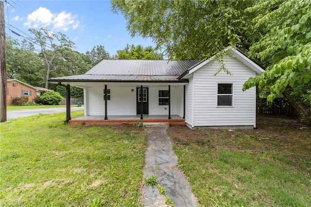 301 Rockspring Rd, High Point, NC 27262 - view of front of house featuring a porch, a front yard, and a metal roof