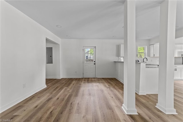 301 Rockspring Rd, High Point, NC 27262 - entryway with electric panel, light wood finished floors, and ornate columns