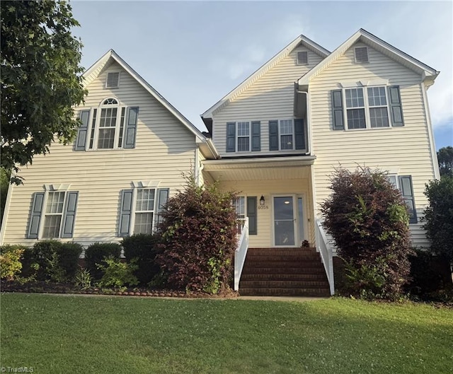 4058 Gunsmith Ct, Jamestown, NC 27282 - traditional home featuring a front lawn