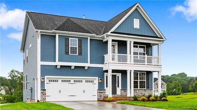 700 Fairmile Dr, Greensboro, NC 27455 - view of front of home featuring a balcony, a porch, concrete driveway, a front lawn, and a garage