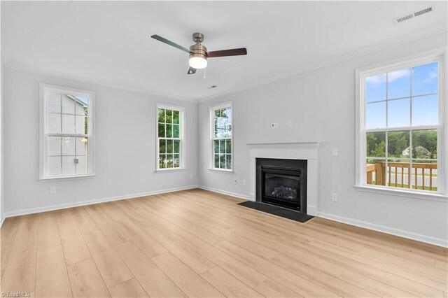 700 Fairmile Dr, Greensboro, NC 27455 - unfurnished living room with light wood-type flooring, a ceiling fan, baseboards, and crown molding