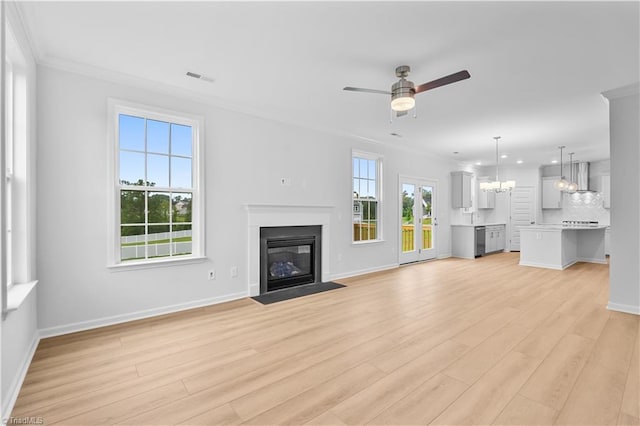 700 Fairmile Dr, Greensboro, NC 27455 - unfurnished living room featuring ceiling fan, light wood-type flooring, a fireplace with flush hearth, crown molding, and a chandelier