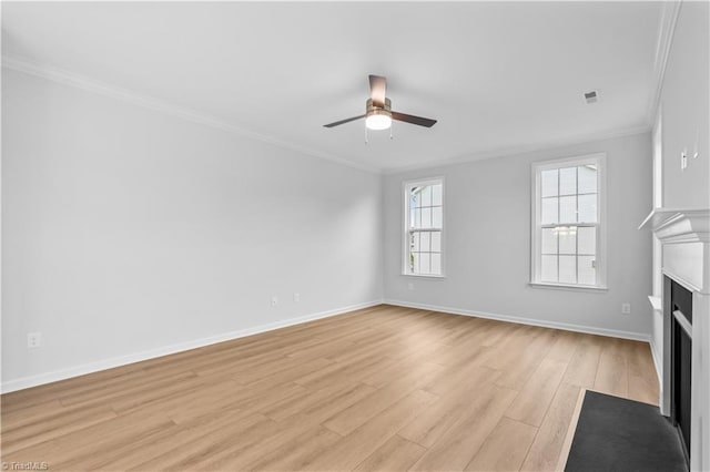 700 Fairmile Dr, Greensboro, NC 27455 - unfurnished living room featuring ceiling fan, a fireplace with flush hearth, ornamental molding, light wood-style floors, and baseboards