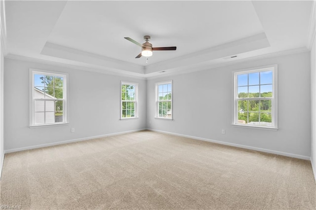 700 Fairmile Dr, Greensboro, NC 27455 - unfurnished room featuring a raised ceiling, ornamental molding, a ceiling fan, carpet floors, and baseboards