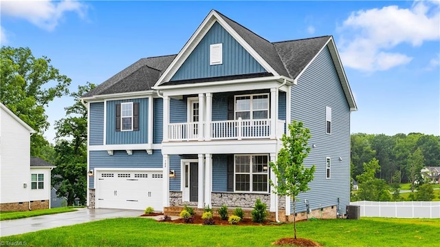 700 Fairmile Dr, Greensboro, NC 27455 - view of front of home with a balcony, board and batten siding, covered porch, driveway, and a front yard