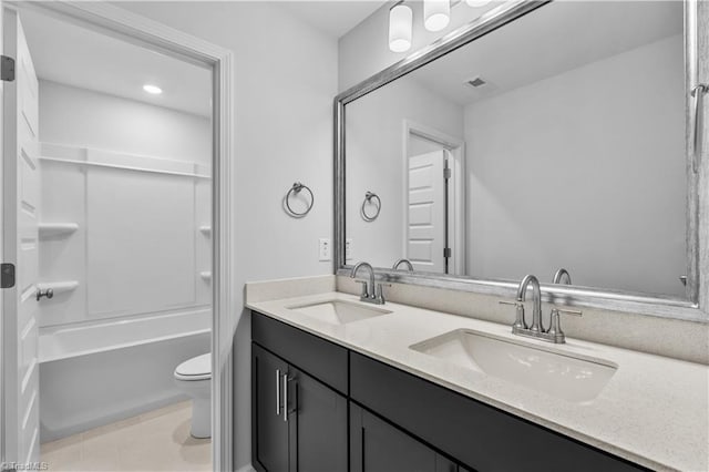700 Fairmile Dr, Greensboro, NC 27455 - full bath featuring toilet, double vanity, tile patterned floors, and shower / bathtub combination
