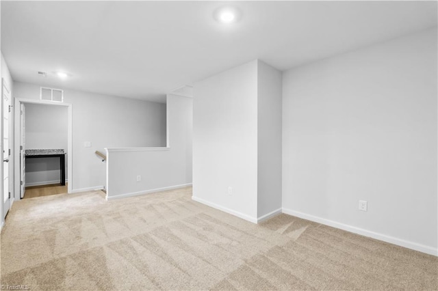 700 Fairmile Dr, Greensboro, NC 27455 - unfurnished room with light colored carpet, baseboards, and recessed lighting
