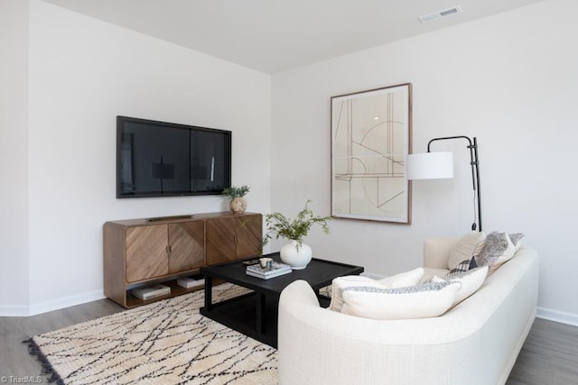 living room with dark wood-type flooring