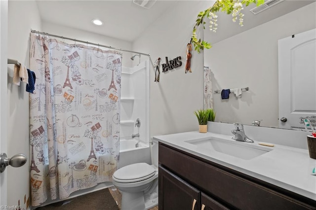 bathroom featuring toilet, visible vents, vanity, and shower / tub combo with curtain