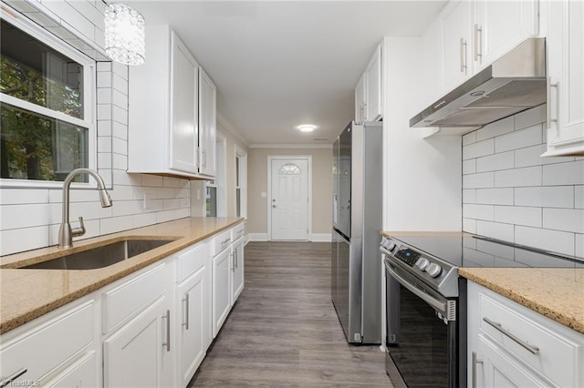 kitchen featuring sink, stainless steel appliances, dark hardwood / wood-style floors, backsplash, and white cabinets