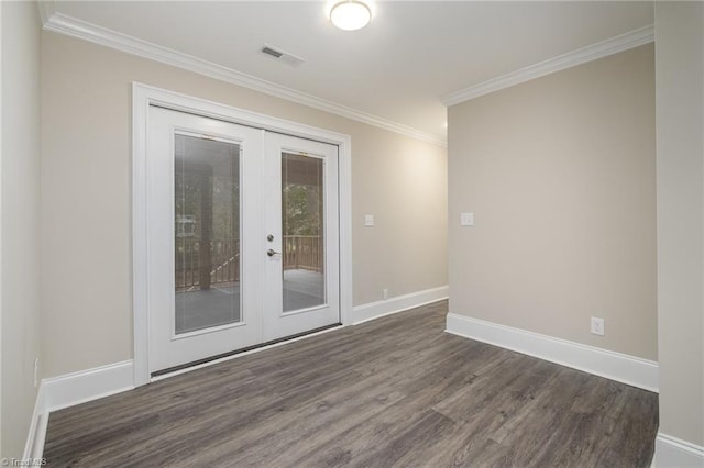 empty room with dark hardwood / wood-style flooring, crown molding, and french doors