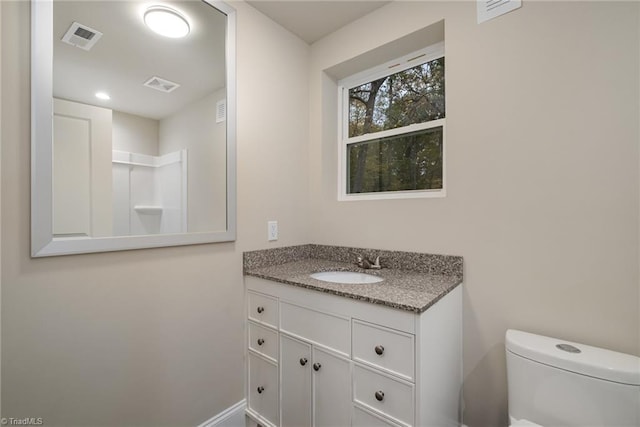 bathroom with vanity and toilet