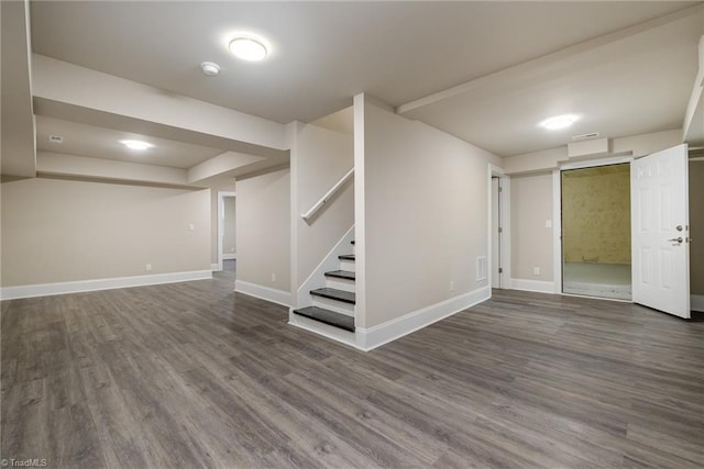 basement featuring dark wood-type flooring