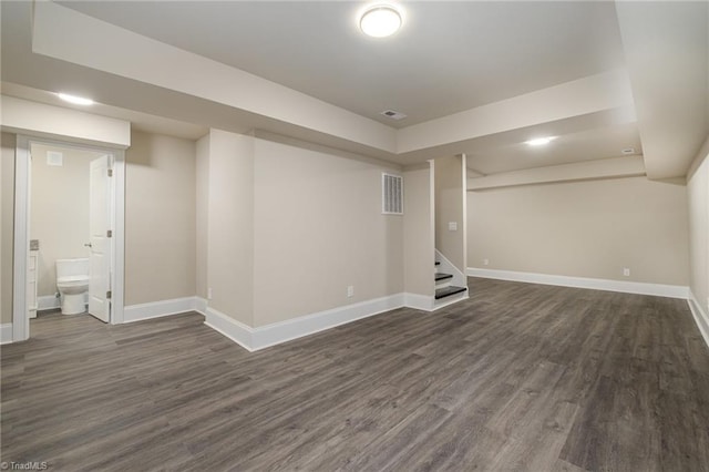 basement featuring dark hardwood / wood-style floors