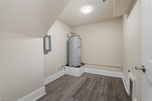 utility room featuring electric panel and water heater