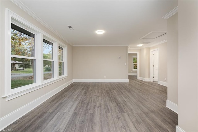 unfurnished room featuring ornamental molding and dark wood-type flooring