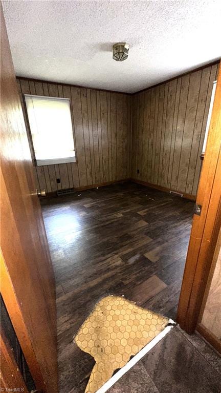 225 Dan Bryant Rd, Pilot Mountain, NC 27041 - unfurnished room featuring dark wood-style floors, a textured ceiling, and wood walls