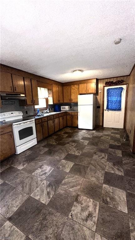 225 Dan Bryant Rd, Pilot Mountain, NC 27041 - kitchen featuring white appliances, extractor fan, and a textured ceiling