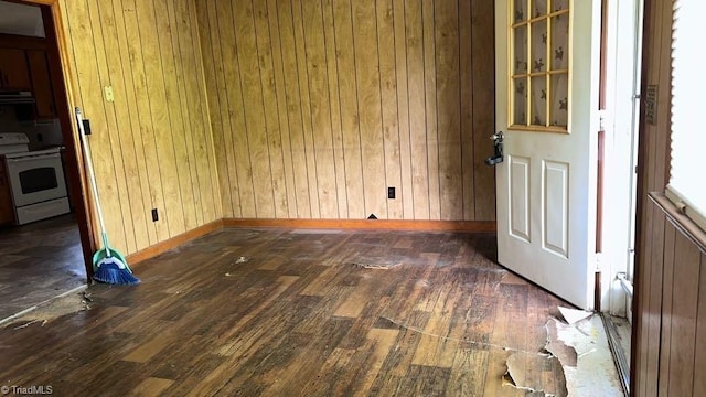 225 Dan Bryant Rd, Pilot Mountain, NC 27041 - unfurnished dining area featuring dark wood-type flooring, wooden walls, and baseboards
