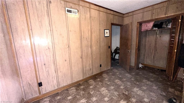225 Dan Bryant Rd, Pilot Mountain, NC 27041 - bedroom featuring ornamental molding, wooden walls, and baseboards