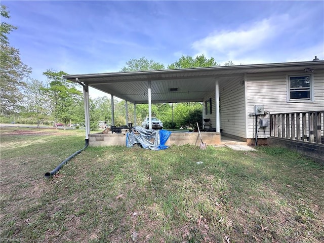 225 Dan Bryant Rd, Pilot Mountain, NC 27041 - view of grassy yard with a carport