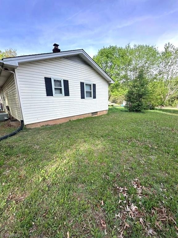 225 Dan Bryant Rd, Pilot Mountain, NC 27041 - view of home's exterior featuring a yard and a chimney