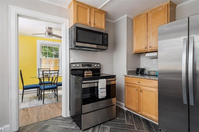 3006 Collier Dr, Greensboro, NC 27403 - kitchen featuring appliances with stainless steel finishes, crown molding, a ceiling fan, and light stone counters