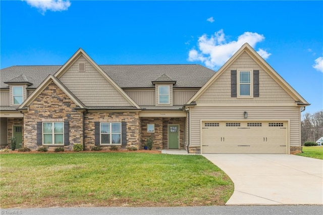 craftsman-style house featuring a garage and a front lawn