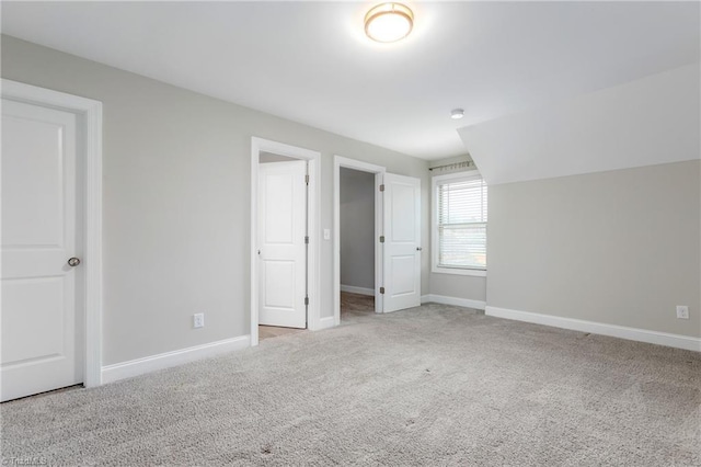 unfurnished bedroom with light colored carpet