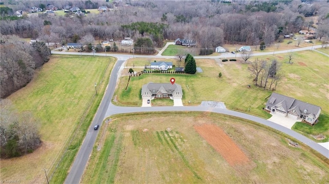 birds eye view of property featuring a rural view