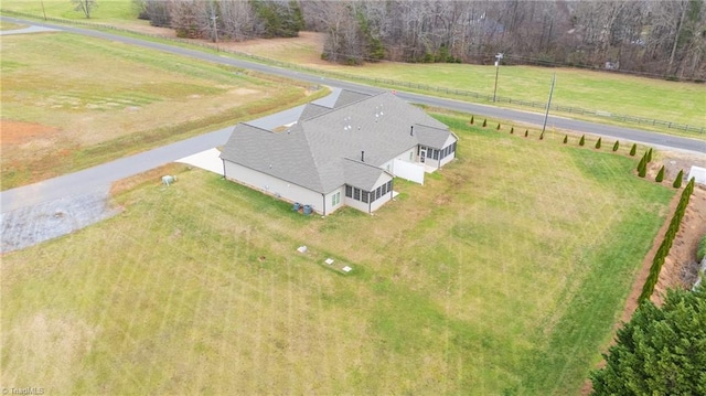 birds eye view of property with a rural view