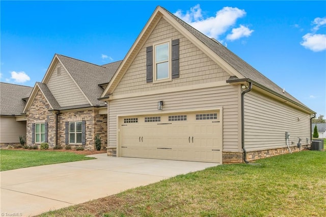 craftsman-style house with central AC unit, a garage, and a front yard