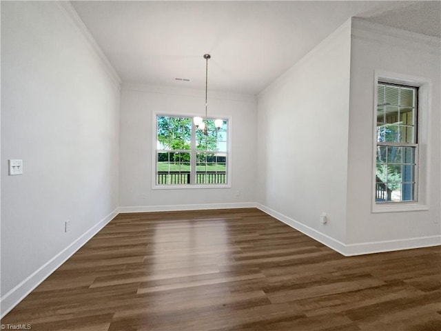 unfurnished dining area with ornamental molding, baseboards, and dark wood-style floors