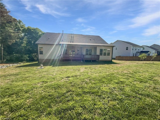 back of house with a yard