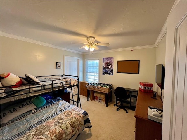 carpeted bedroom featuring ornamental molding and ceiling fan